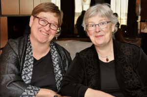 A photo of two women smiling.